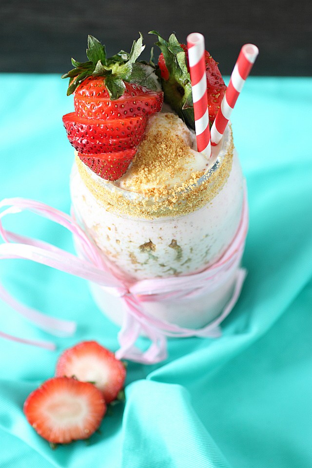 It's hot out. Let's get down with this Strawberry Cream Cheese Milkshake! Creamy vanilla bean ice cream is blended with fresh strawberries, tangy cream cheese, and served with crushed graham crackers. It's a frozen treat you must sip all summer long! {mind-over-batter.com}