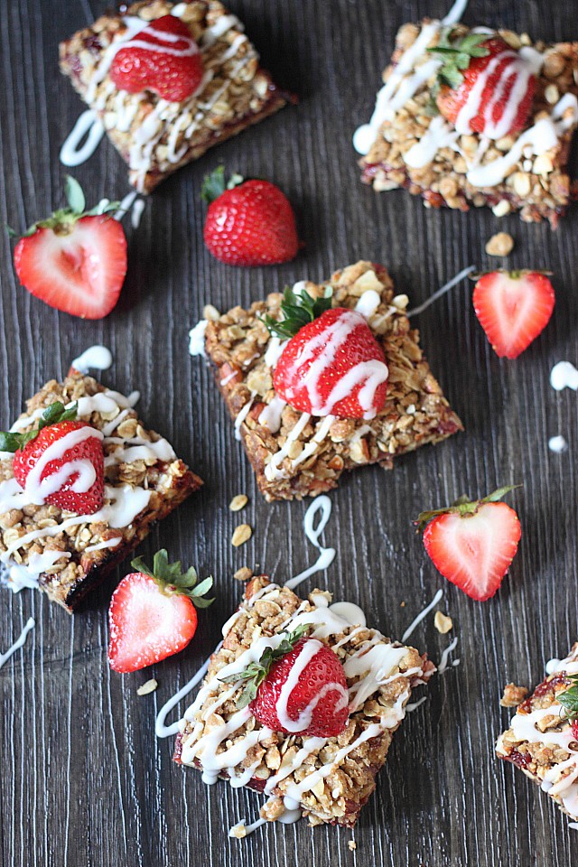 Seasonal Strawberry Vanilla Jam is sandwiched between two delightful almond oat crumble layers! These Strawberry Almond Crumble Bars make a perfect breakfast or afternoon tea snack! -- mind-over-batter.com