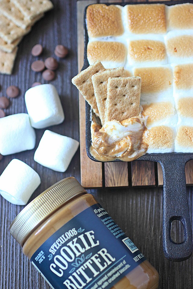 With this Cookie Butter S'mores Dip, you won't need to go camping to enjoy s'mores! Cookie butter is melted with rich milk chocolate and sweet marshmallows to create this seriously addicting s'mores dip! Grab your graham crackers and enjoy s’mores any time!  www.mind-over-batter.com