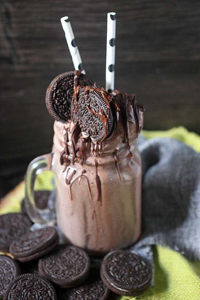 This Boozy Oreo & Chocolate Cream Milkshake is a straight up "eat your feelings" situation. Giant scoops of chocolate ice cream are blended with whole milk, heavy cream, Oreo cookies, chocolate liqueur, and vodka. This "eat your feelings" milkshake is topped with more scoops of chocolate ice cream, Oreo cookies, and melted chocolate! www.mind-over-batter