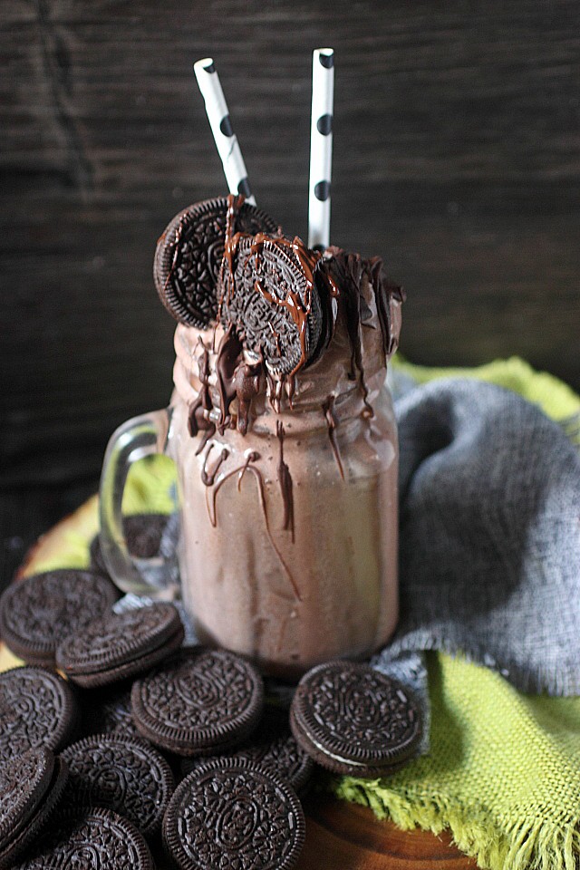 This Boozy Oreo & Chocolate Cream Milkshake is a straight up "eat your feelings" situation. Giant scoops of chocolate ice cream are blended with whole milk, heavy cream, Oreo cookies, chocolate liqueur, and vodka. This "eat your feelings" milkshake is topped with more scoops of chocolate ice cream, Oreo cookies, and melted chocolate! www.mind-over-batter